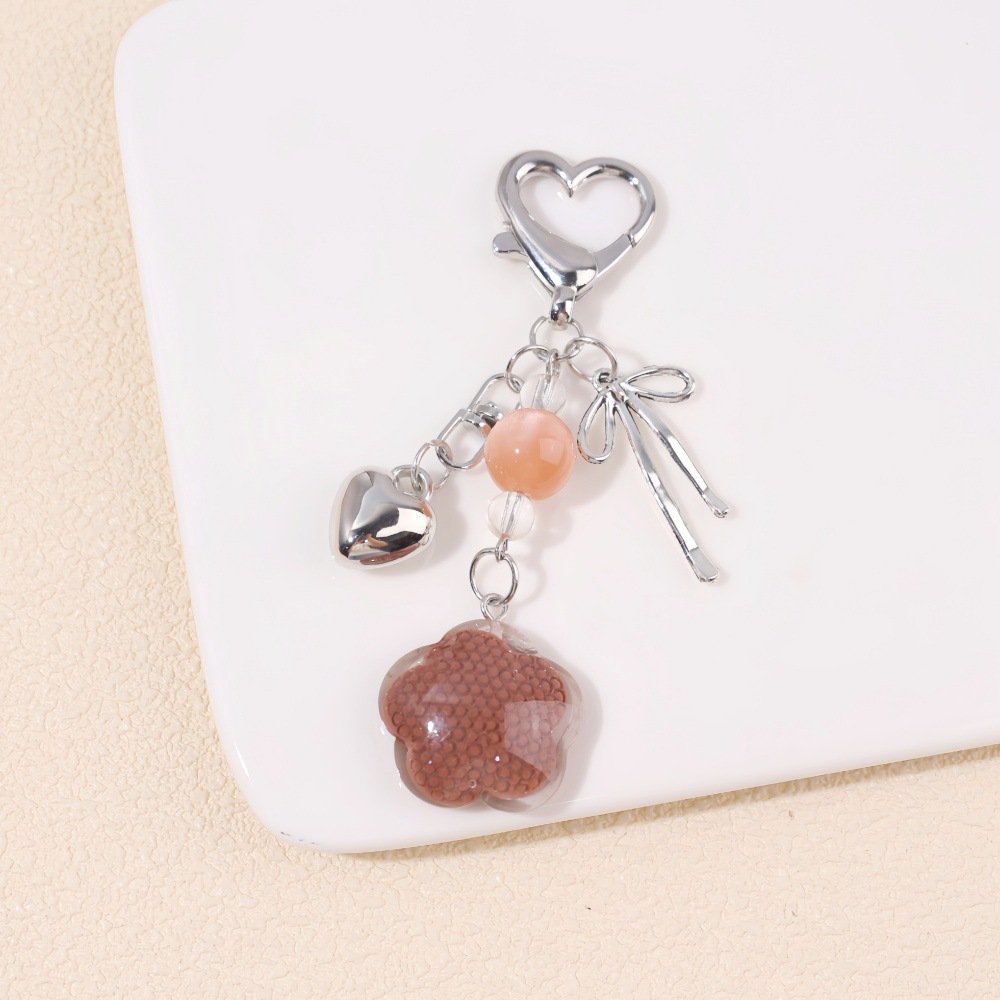 ins resin plum blossom metal bow pearl keychain diy phone bag accessory headphone case hanging charm ins resin plum blossom metal bow pearl keychain diy phone bag accessory headphone case hanging charm