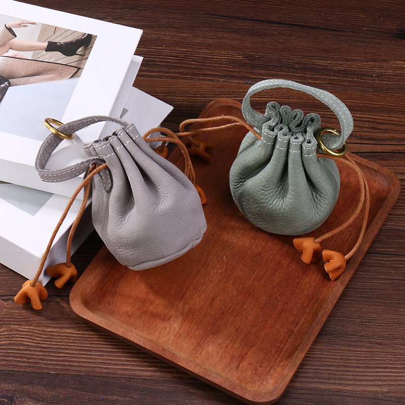 top layer cowhide storage bag, full cowhide headphone accessories, drawstring drawstring storage bag, leather texture lucky bag, coin purse top layer cowhide storage bag, full cowhide headphone accessories, drawstring drawstring storage bag, leather texture lucky bag, coin purse